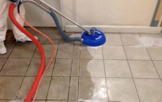 A clean tiled floor with gleaming grout lines.